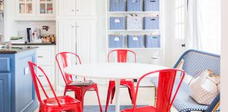 white breakfast table with red tolix chairs and blur accents