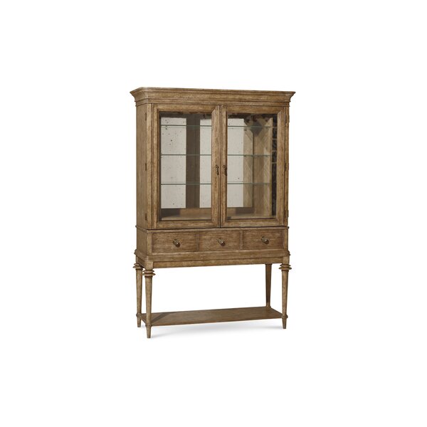 Antique cellarette inspired bar cabinet with mirrored backing. 