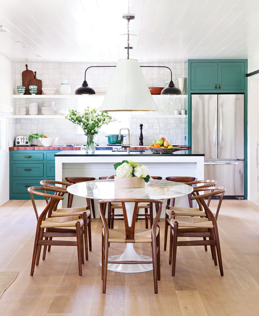 The motto "A Place for Everything and Everything In It's Place" really rings true when it comes to paring back. Christina Simon of Mark Ashby Design created this open plan kitchen/dining room in Austin, Texas so that there would be room for the essentials and those essentials would make up the design. Photo by Bret Gum. 