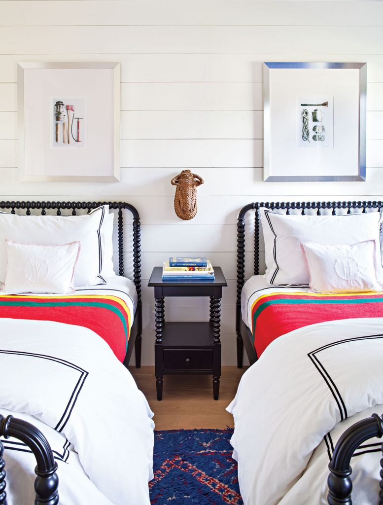 For this kid's room designed by Christina Simon of Mark Ashby Design, a simple shared nightstand is perfectly functional in a small space and yet keep clutter at bay. Photo by Bret Gum. 