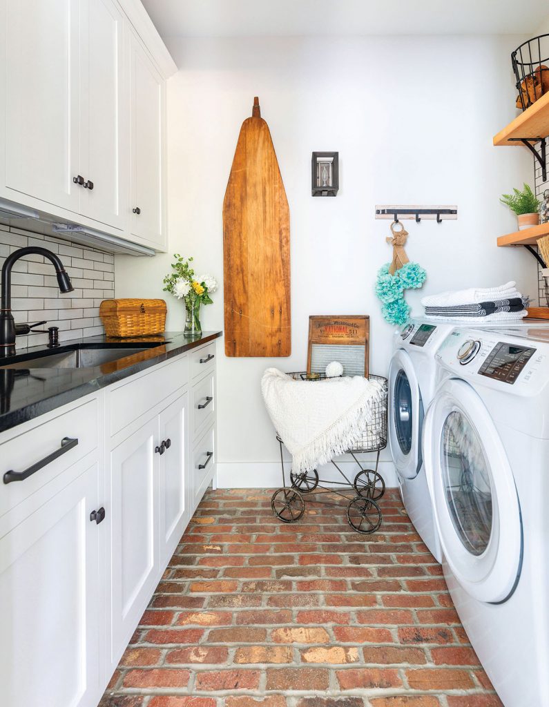 Project House laundry rom with cherokee brick flooring and a vintage ironing board and laundry basket // whole house deep clean