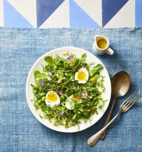 mixed green and tossed herb salad with peas and soft boiled eggs