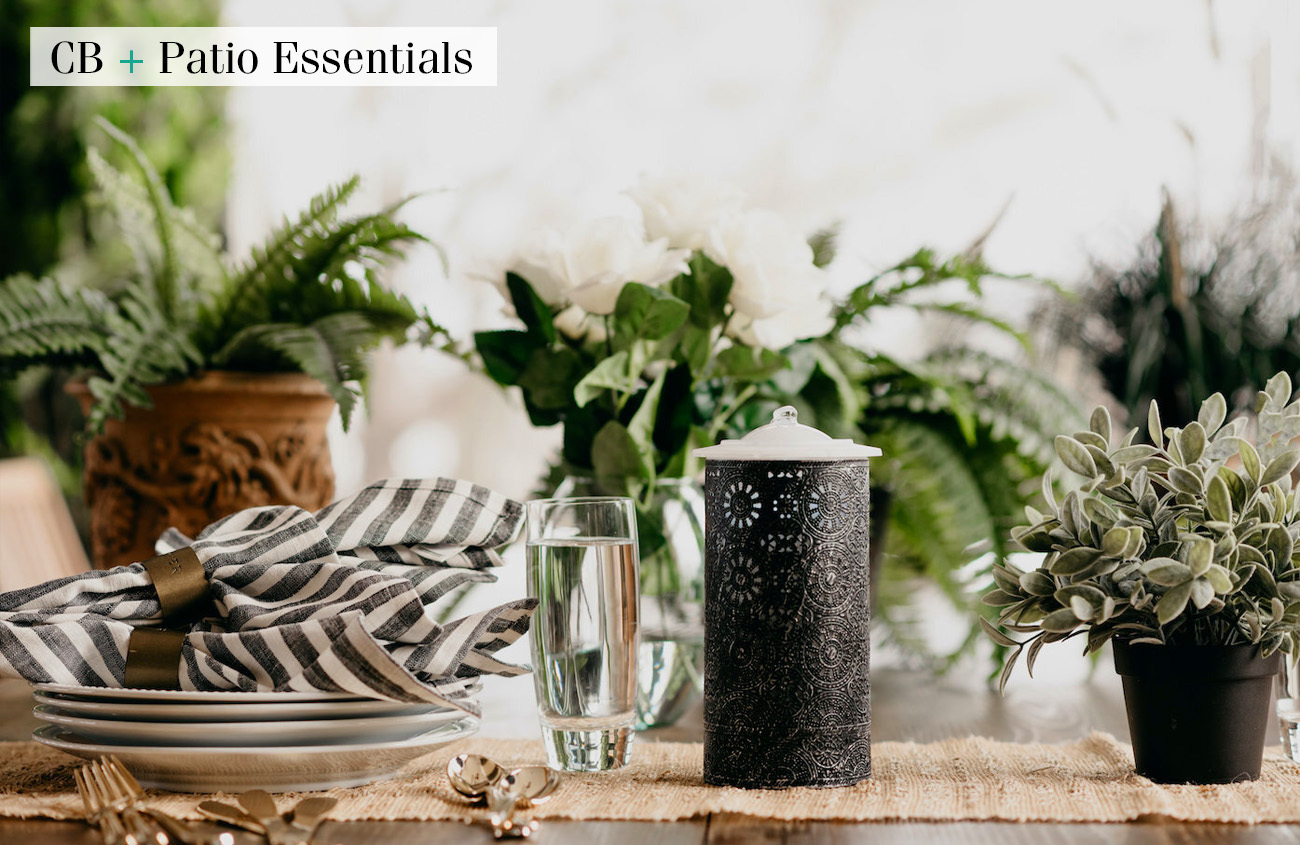 Black and white candle on set table from Patio Essentials