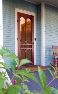 Brown front door with historic details for custom doors