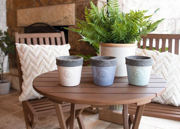 Set of three vintage pot candles on tabletop from Patio Essentials