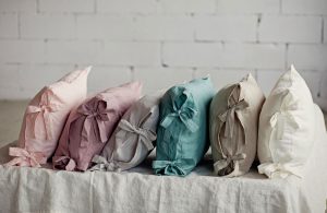ribbon tie linen pillow cases all in a row