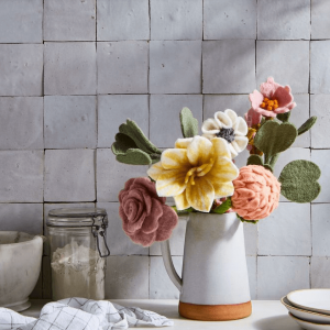 Bouquet of felt flowers in jug