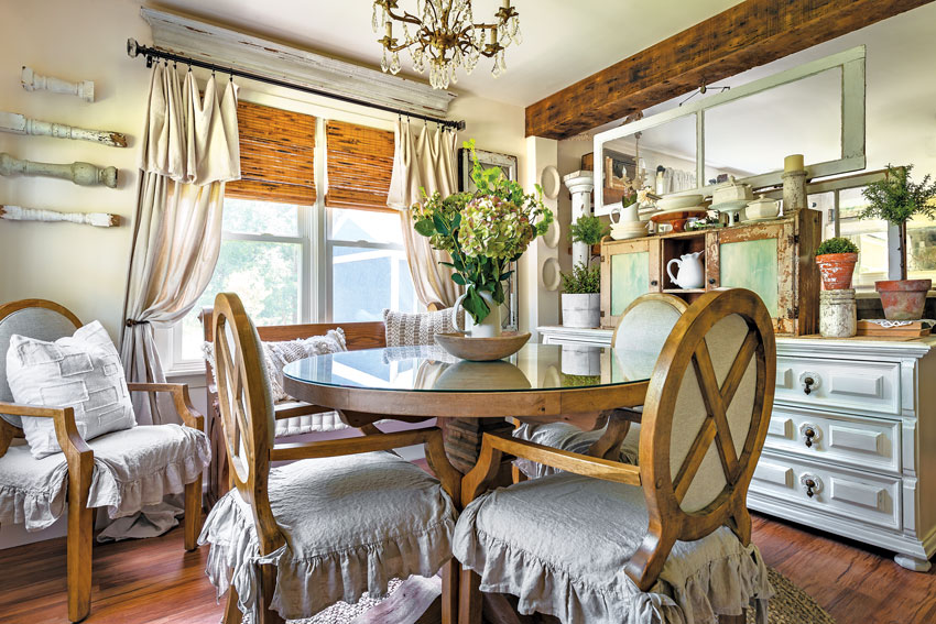 Vintage spindles, cabinets and window frames give this dining room inimitable texture