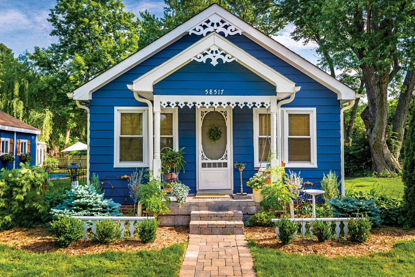 Small country cottage in bright blue paint 