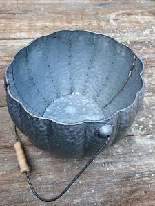 Metal pumpkin-shaped bucket.