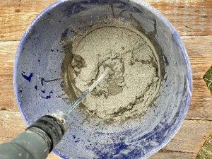 Cement for cement pumpkin bowl is mixed in a separate bucket.