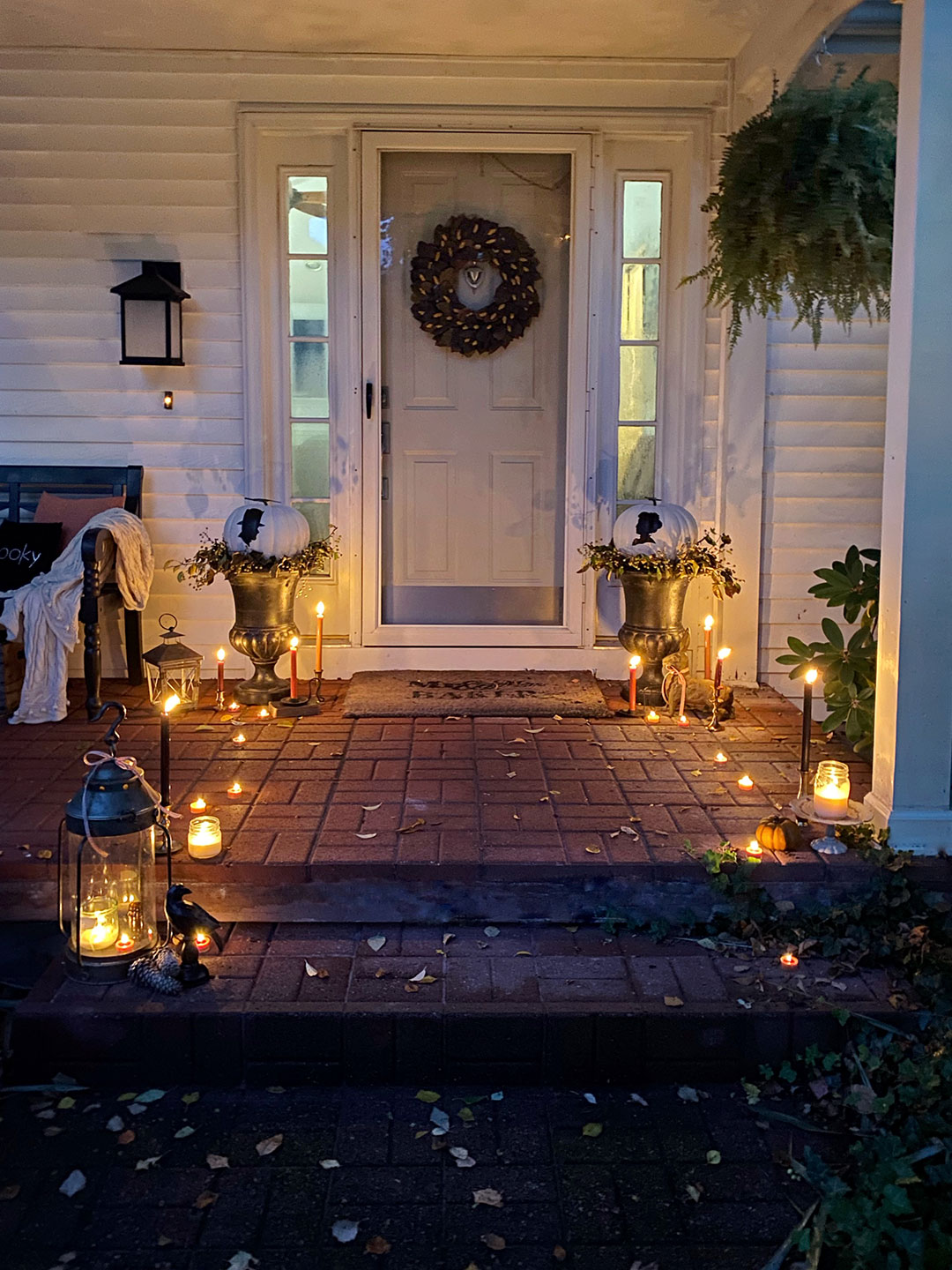 Halloween porch decor with custom no-cut pumpkins painted with vintage-stlye silhouettes