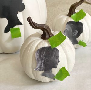 Side portrait taped to pumpkin to create outline for silhouette