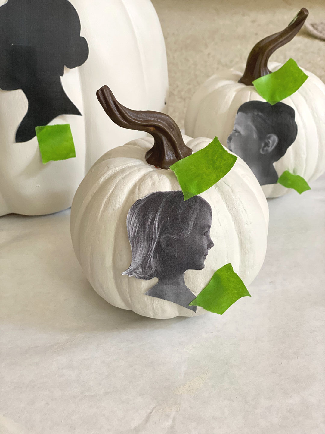 Side portrait taped to pumpkin to create outline for silhouette