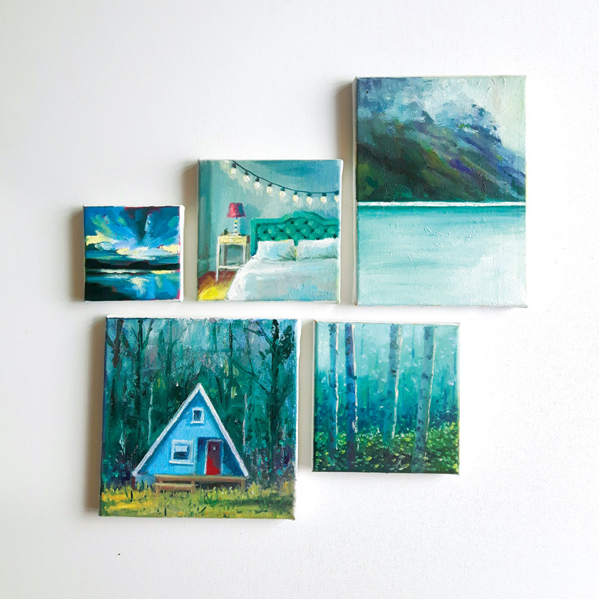 A collection of small blue colored Marleen Kleiberg 's paintings on a white background