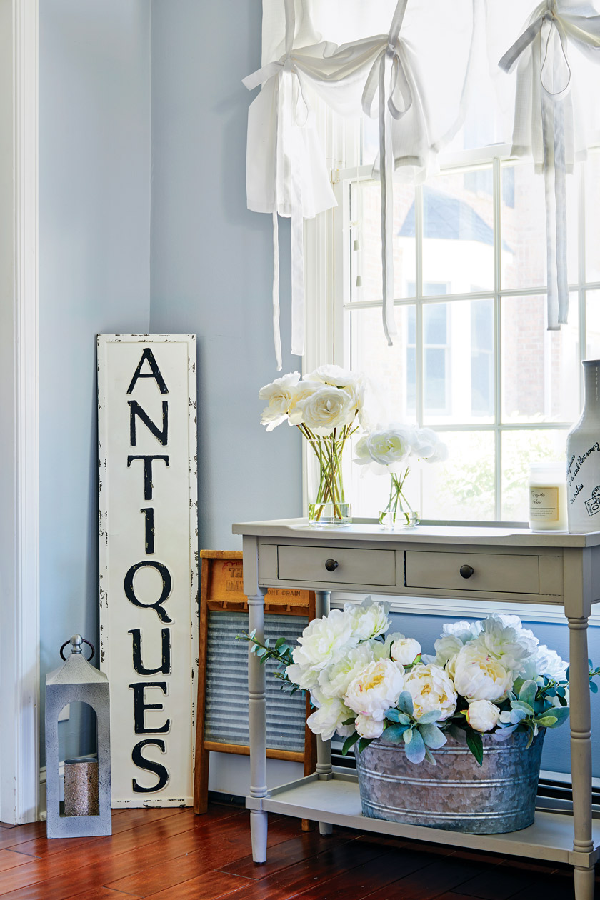 sunny corner with an "antiques" sign 