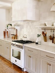 Not everyone likes a white kitchen, and these lower cabinets are the perfect neutral greige.