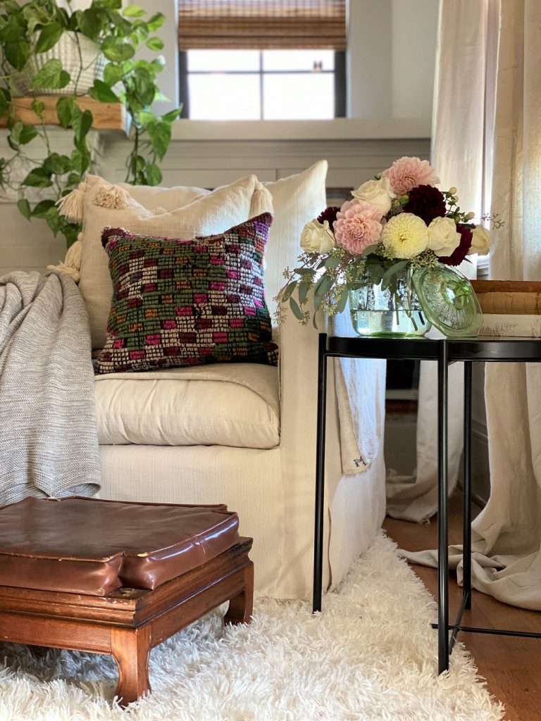 A vessel of florals on a side table is the perfect touch.