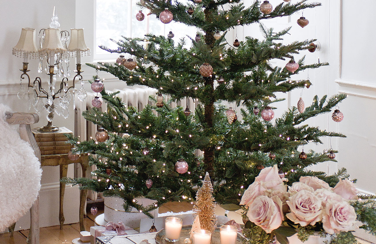 living room and Christmas tree decorated with pink roses