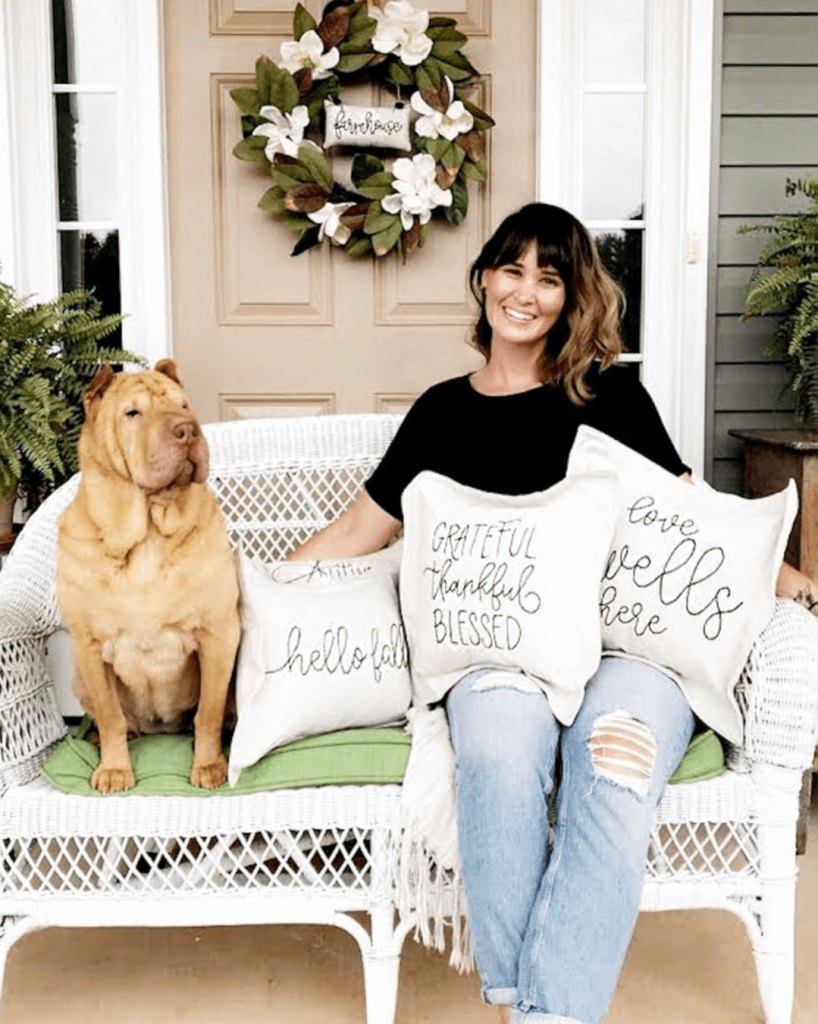 Rosana Milam posing with her dog and pillows