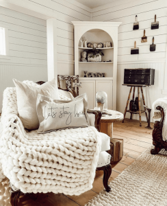 A living room featuring one of Rosana Milam's hand embroidered pillows