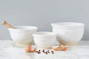 Three white thrown mixing bowls