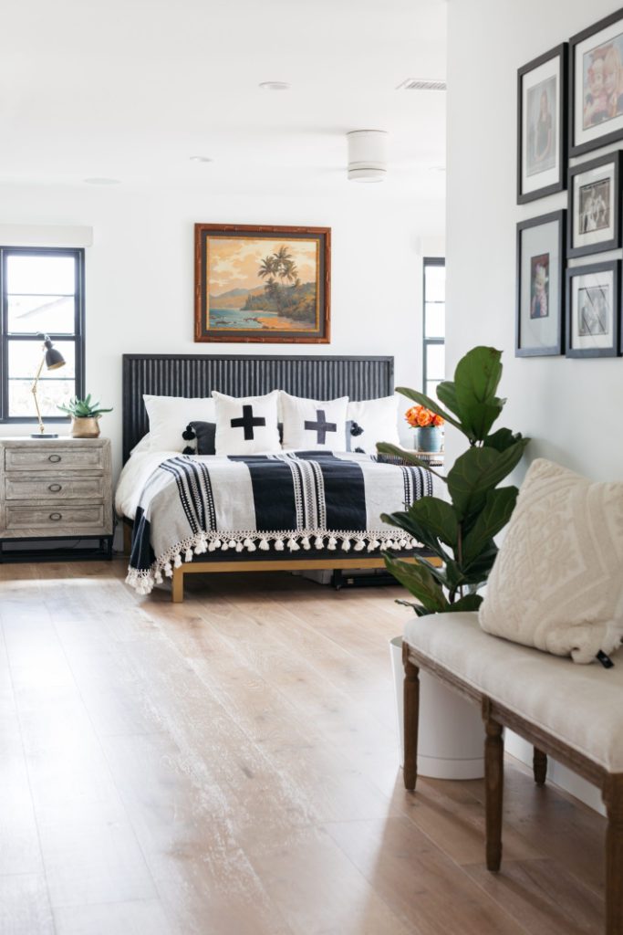 View of bedroom with black, white, and tan details