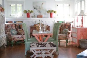 Dining room with a vintage picnic table and two wing chairs