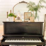 Piano topped with beachside décor, like shells and wicker details