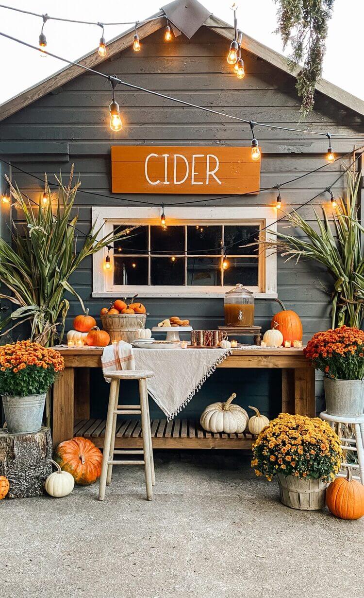Backyard area and cider bar decorated for fall