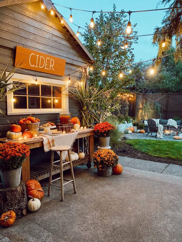 Backyard area and cider bar decorated for fall