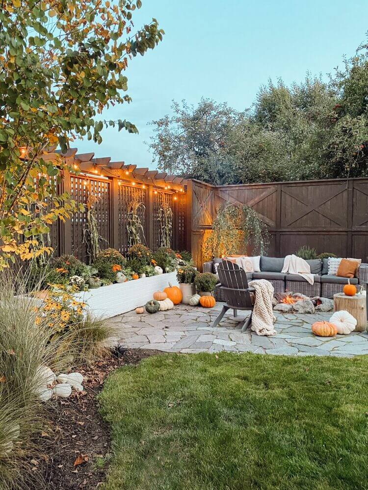Backyard sitting area decorated for fall