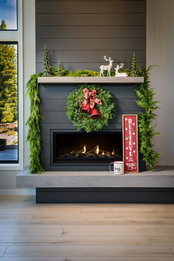 Lynch Creek Farm's Red Bells Wreath displayed on a fireplace