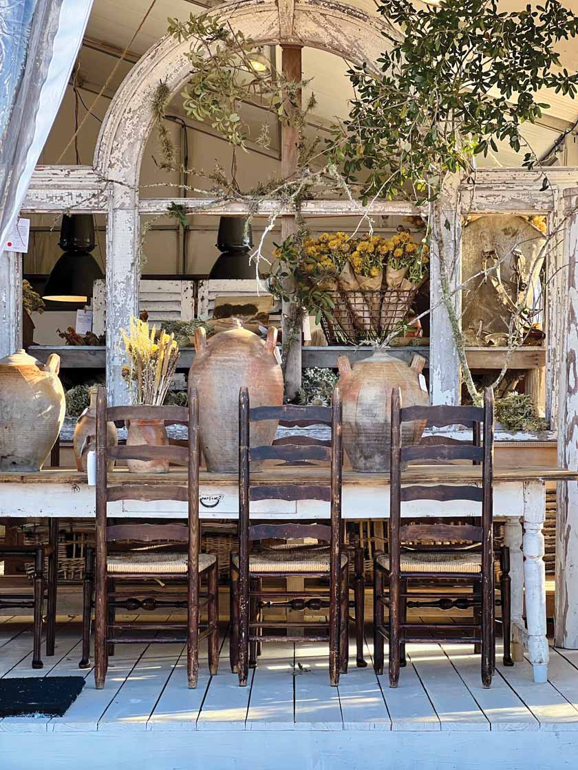 exterior with antique furniture and oversized storage jars