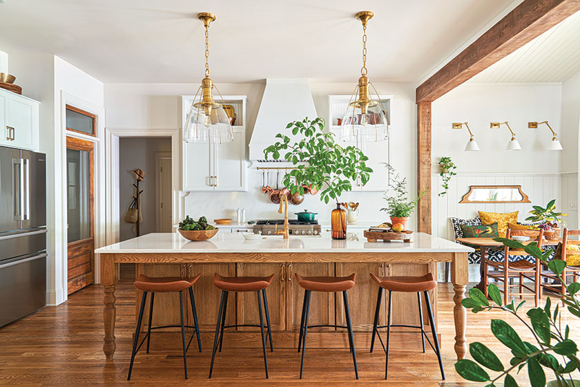 white and oak kitchen with large island and clear lighting fixtures