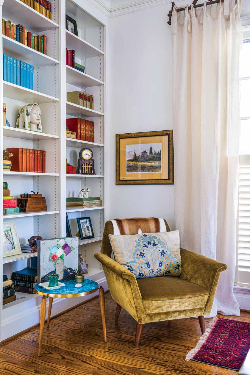 library with gold velvet armchair in historic Nashville home