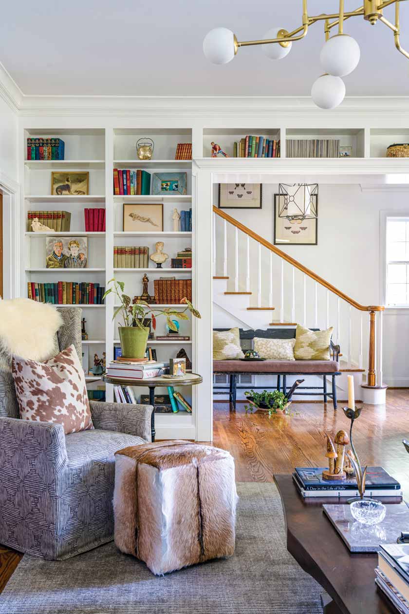 sitting room in colorful historic home in Nashville with built-in shelves