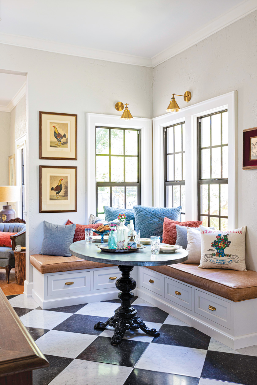 built-in nook with sconce lighting and pane windows in 1920s remodeled kitchen