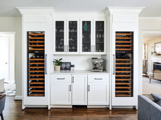 white cabinetry and built in shelves for wine storage