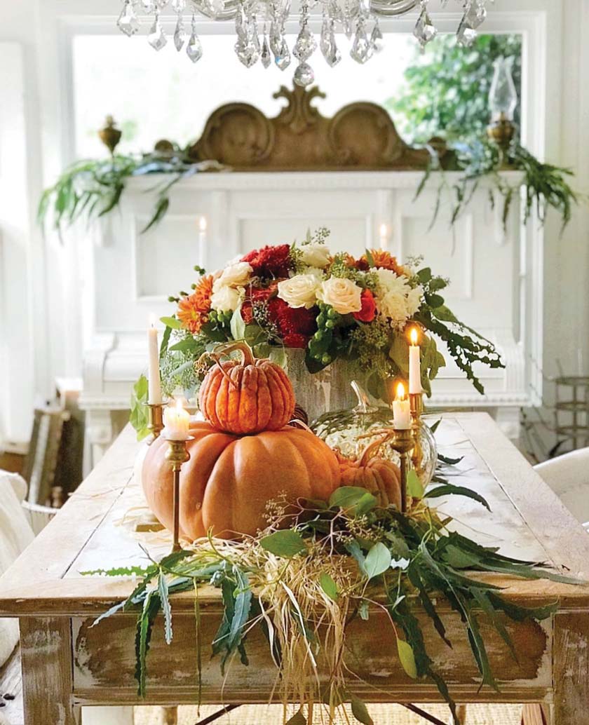 farmers market fall tablescape with fall bouquet and stacked pumpkins