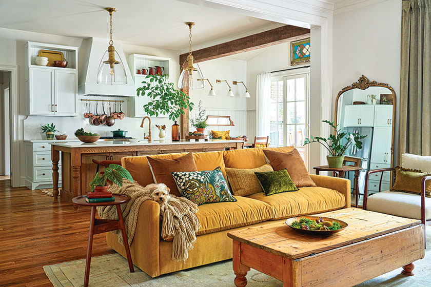 ochre sofa in open concept kitchen and living area