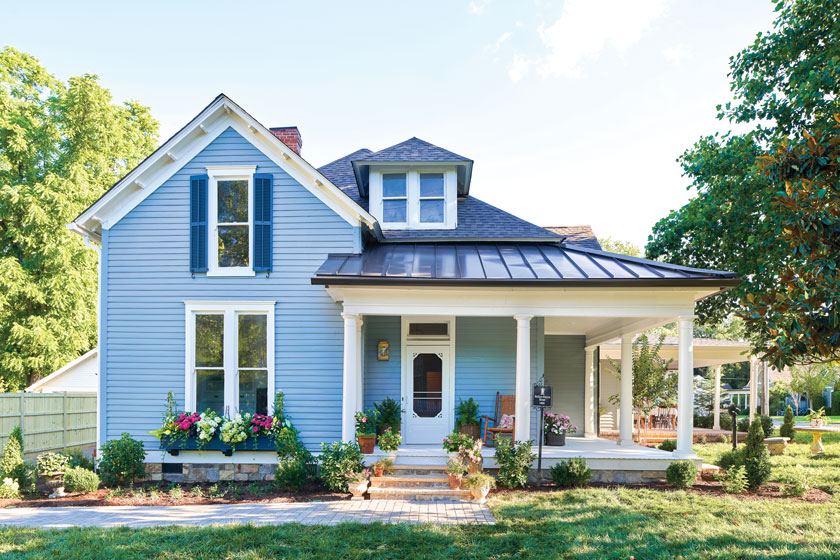 after Project House in Frankline exterior with flowers and blue siding