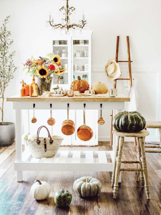farmers market fall kitchen with pumpkins and sunflower bouquet