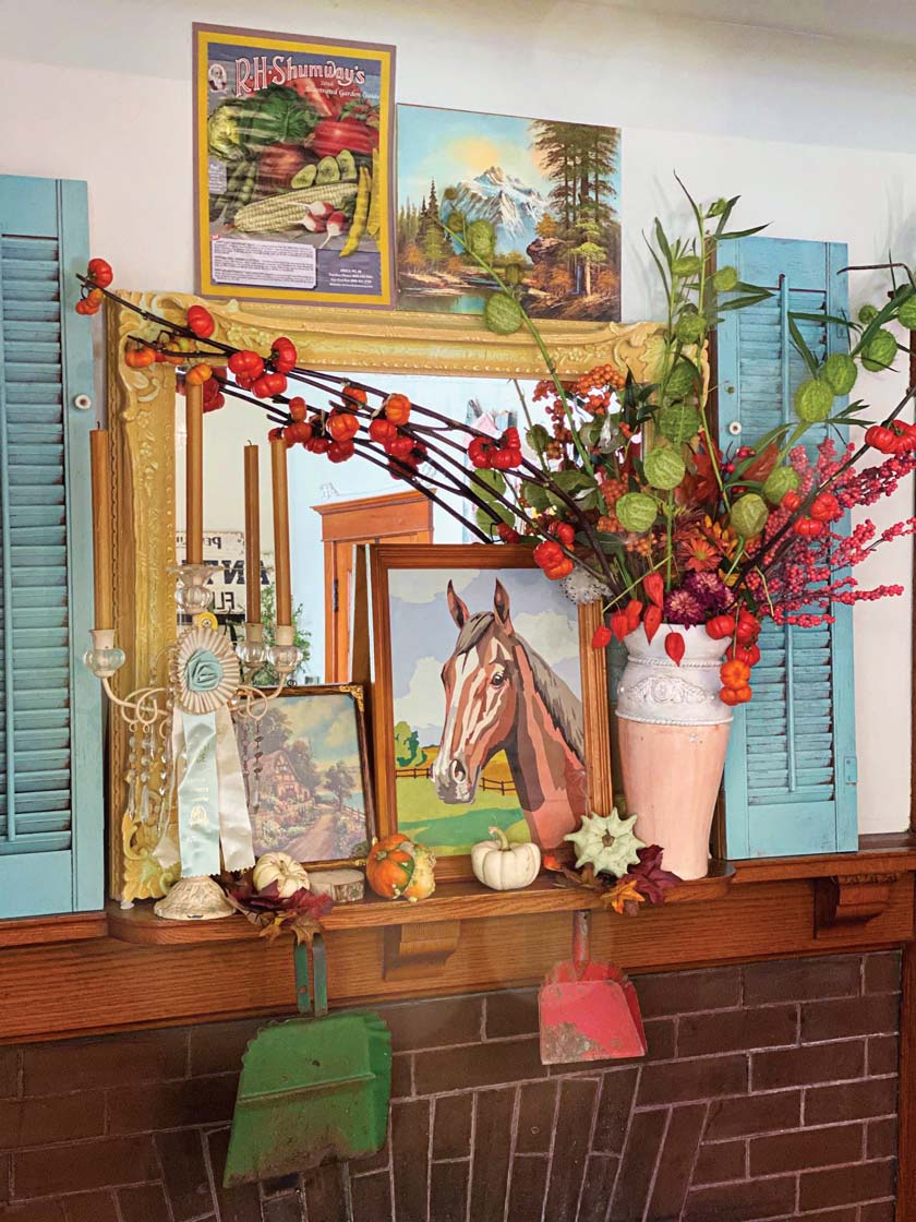 mantel with fall bouquet and gallery wall