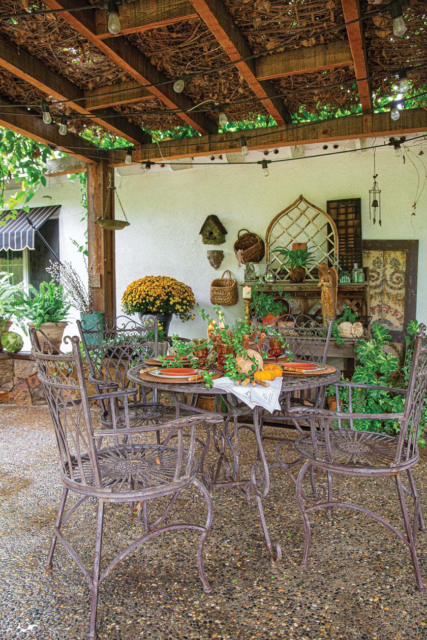 outdoor covered dining area with wrought iron furniture