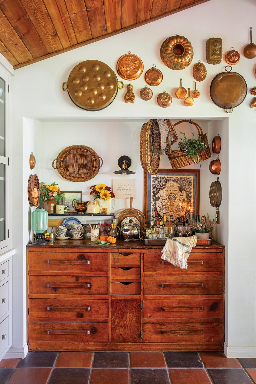 hanging collection of vintage bakeware in maximum style cottage