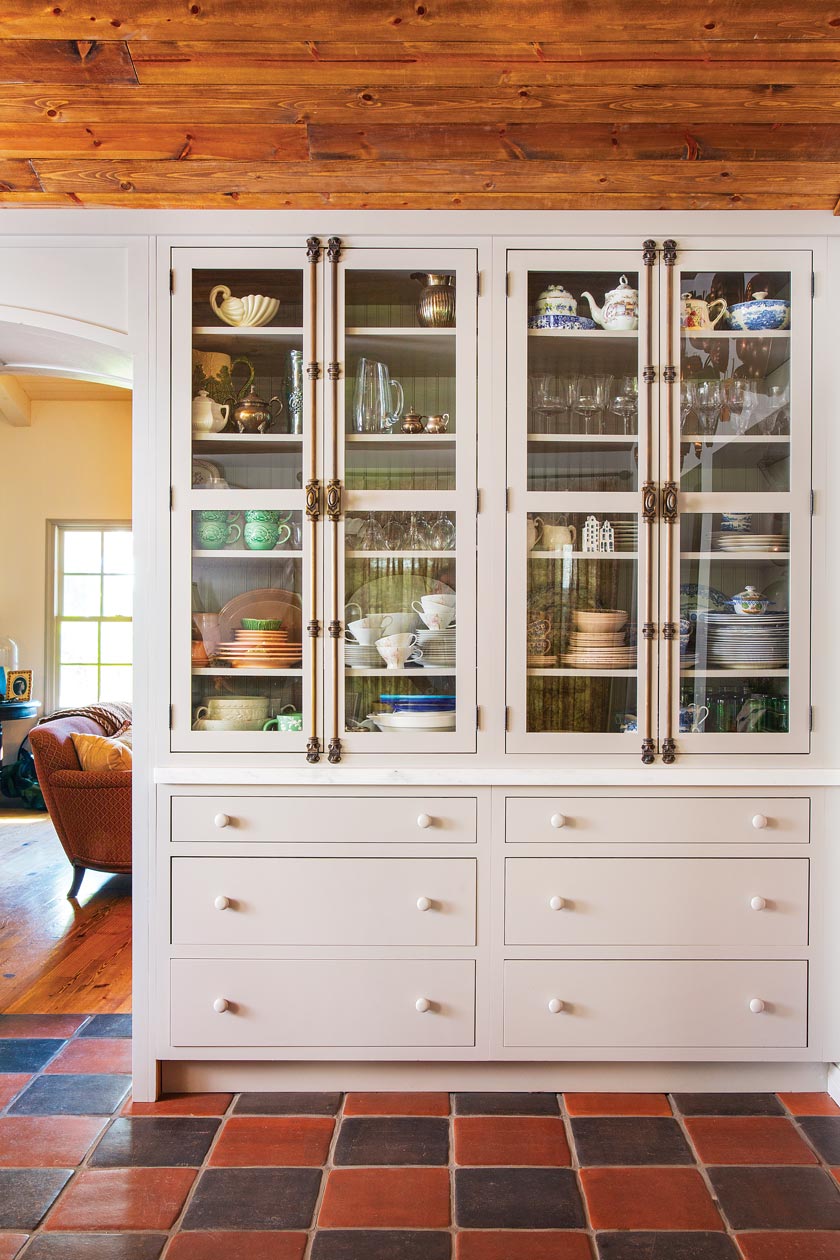 floor to ceiling hutch displaying dishware and glassware collection in maximum style cottage