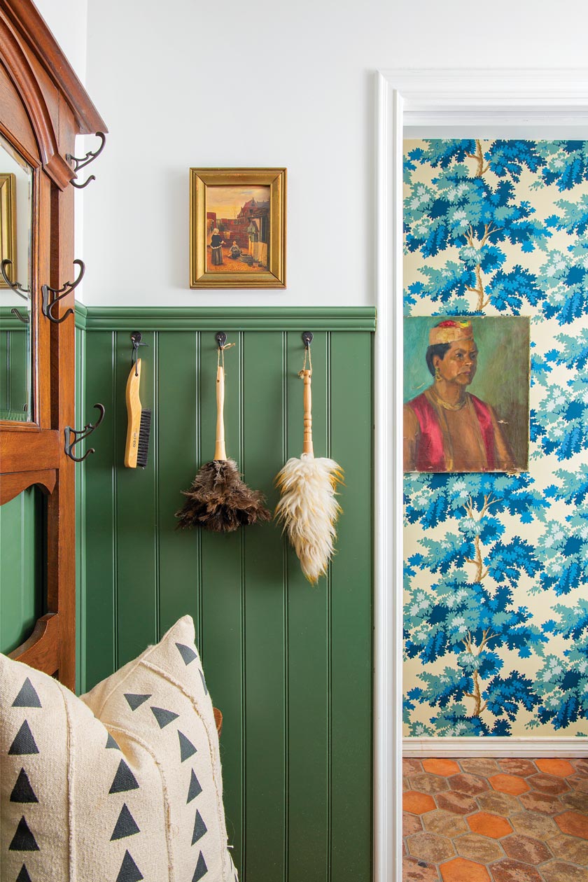 tree wallpaper in hallway and green wainscoting in maximum style cottage