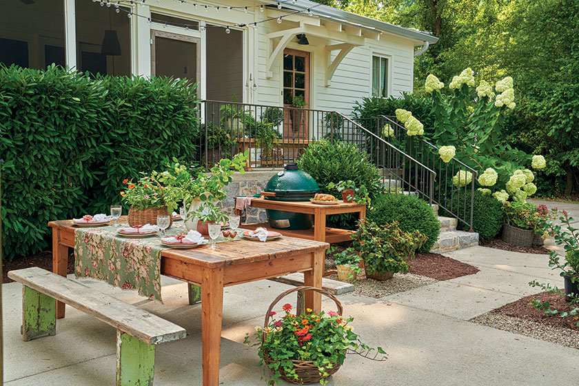 patio with wood picnic table and benches