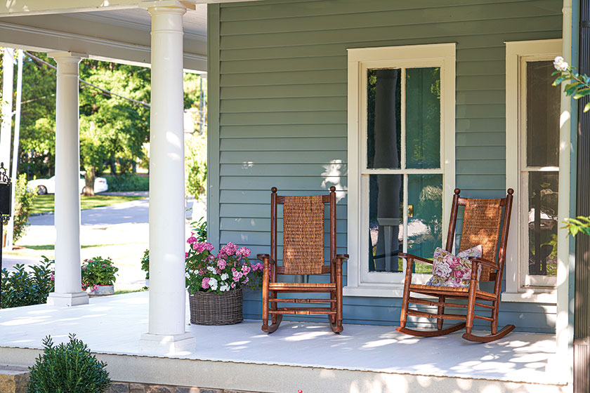 porch in renovated farmhouse cottage with rocking chairs